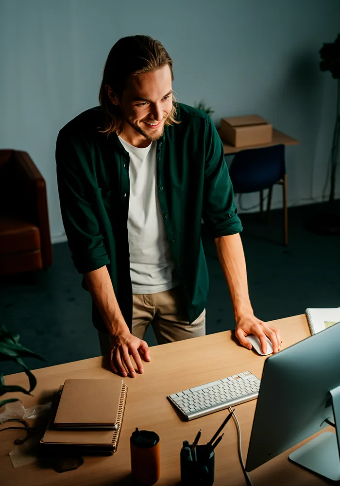 young man working in front of a desk